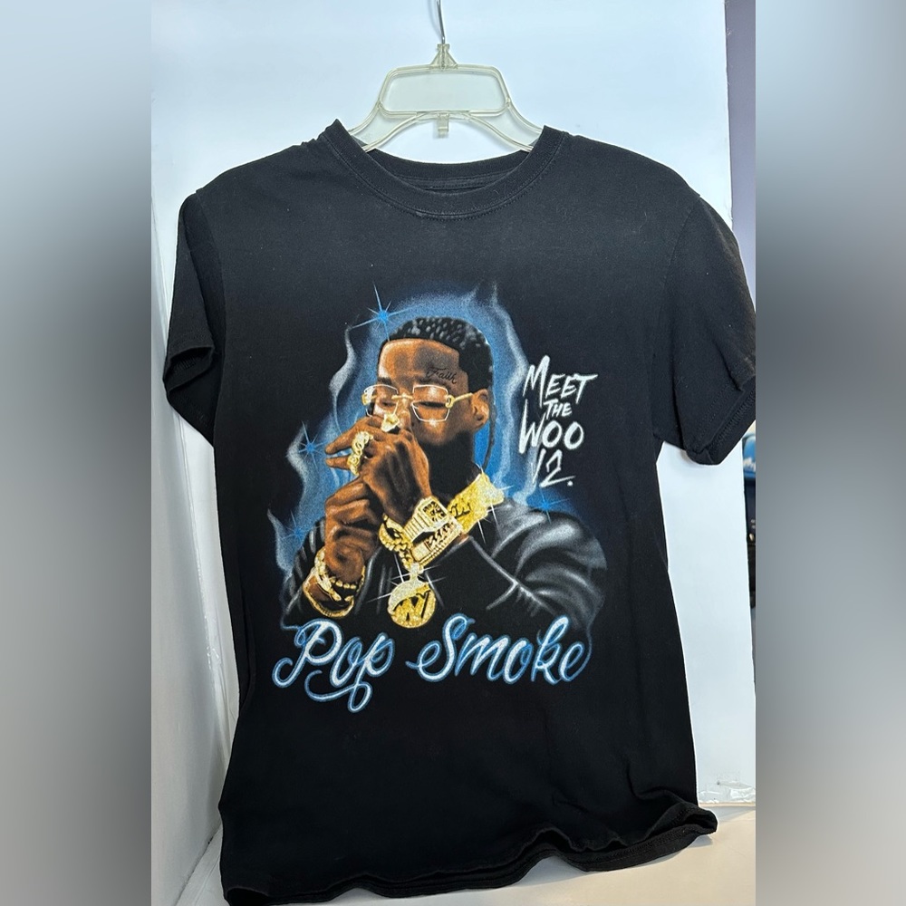 Size small black Pop Smoke Shirt and I got it from Spencer’s.